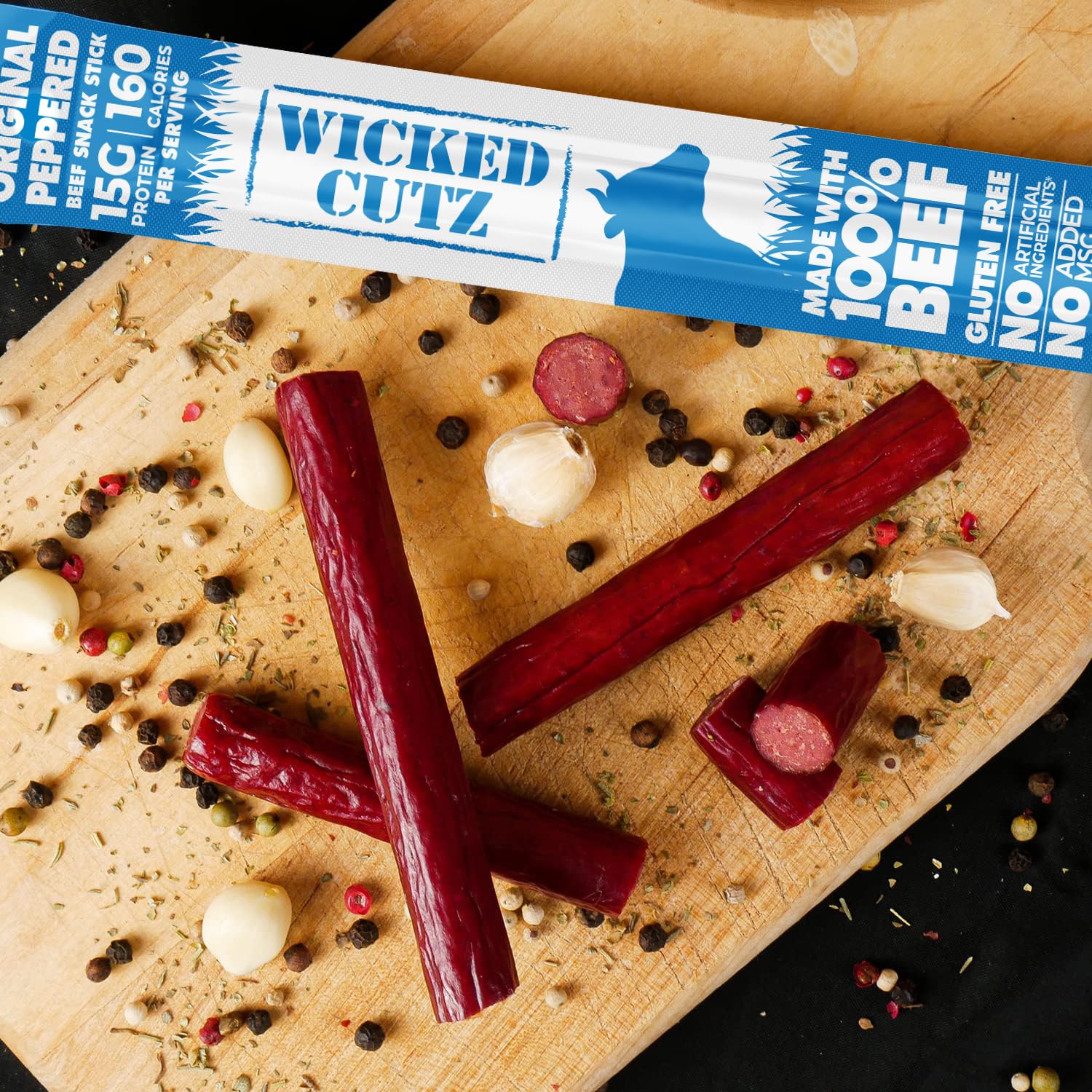 Hand holding Wicked Cutz Original Peppered Beef Sticks for quick fueling
