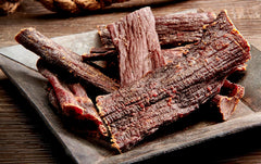 Wild Bill's Hickory Smoked Beef Jerky Strips ready-to-eat, ideal for on-the-go protein.