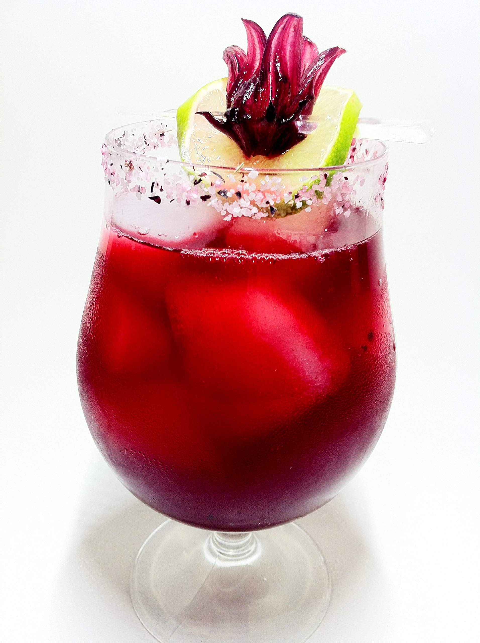 Wild Hibiscus syrup being poured over pancakes for versatile use.