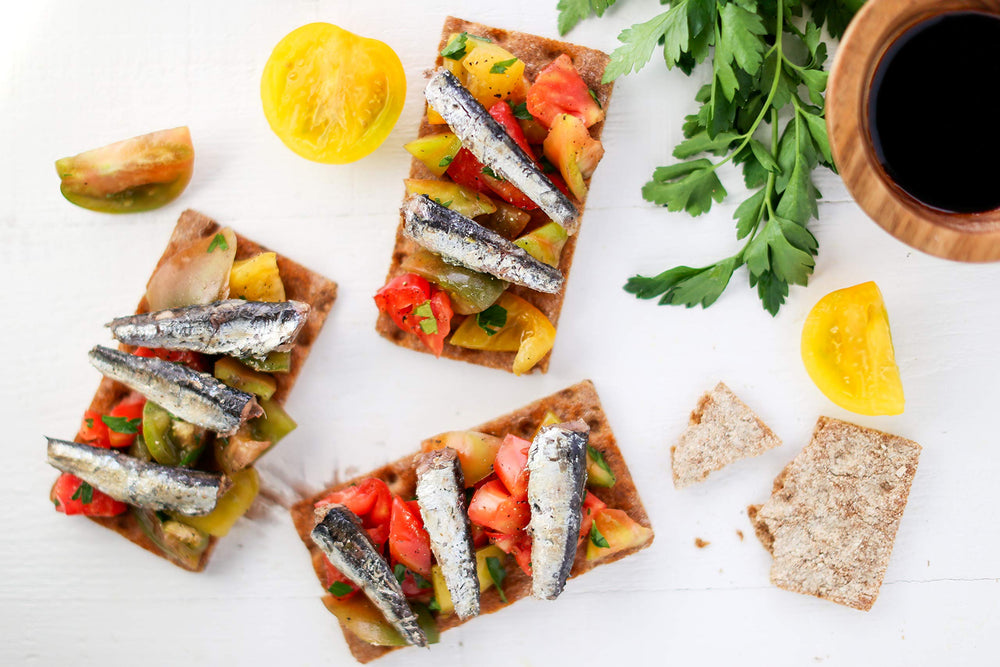 Anchovies arranged on a board for tapas and antipasto