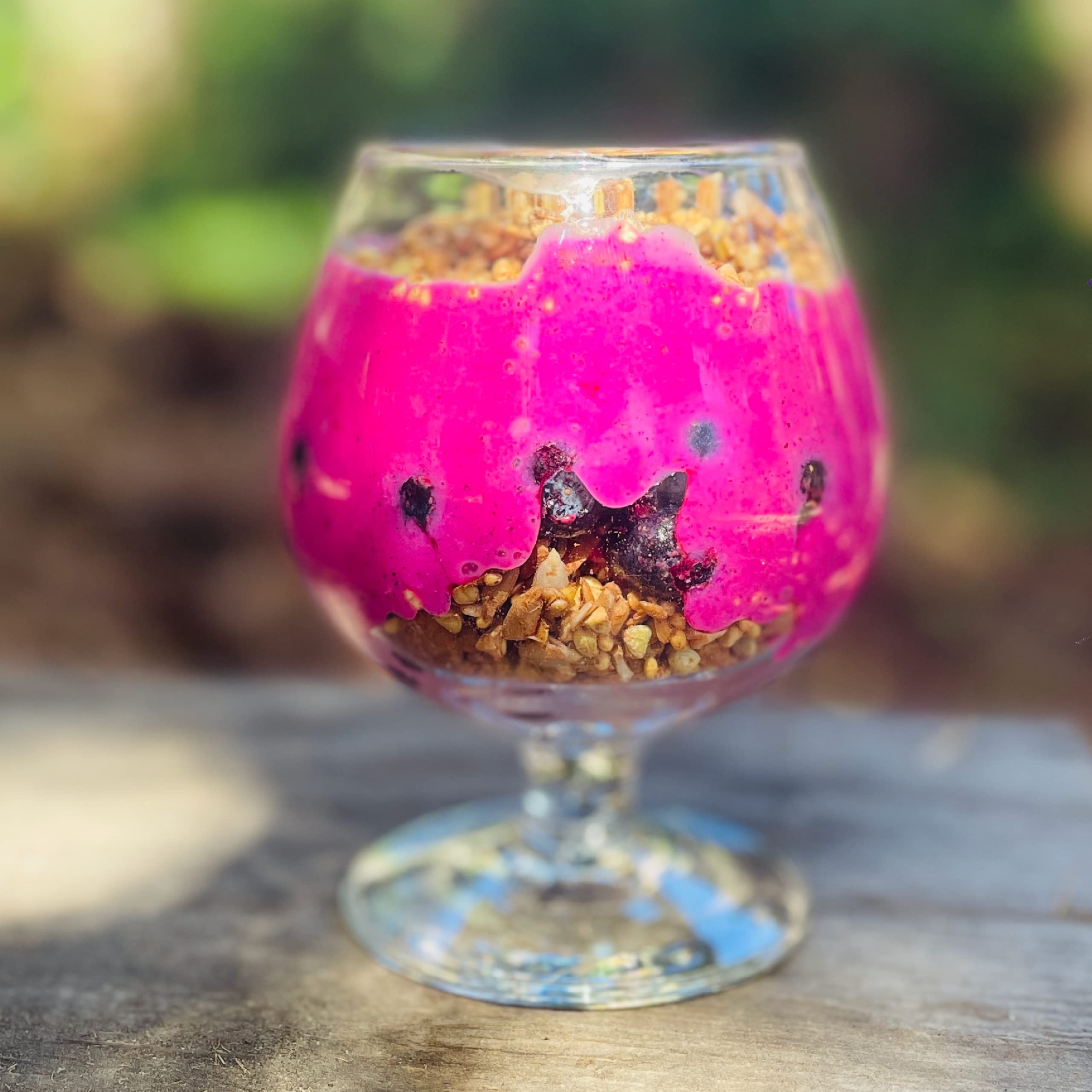 Dragon fruit powder granola topping adding purple hue to cereal