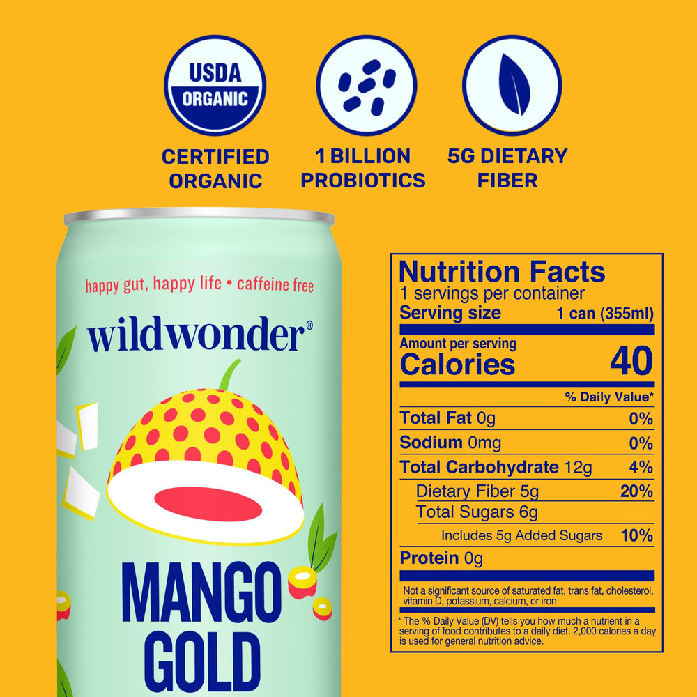 Wildwonder Mango Gold bottle on table beside fresh mango slices, ready to sip.