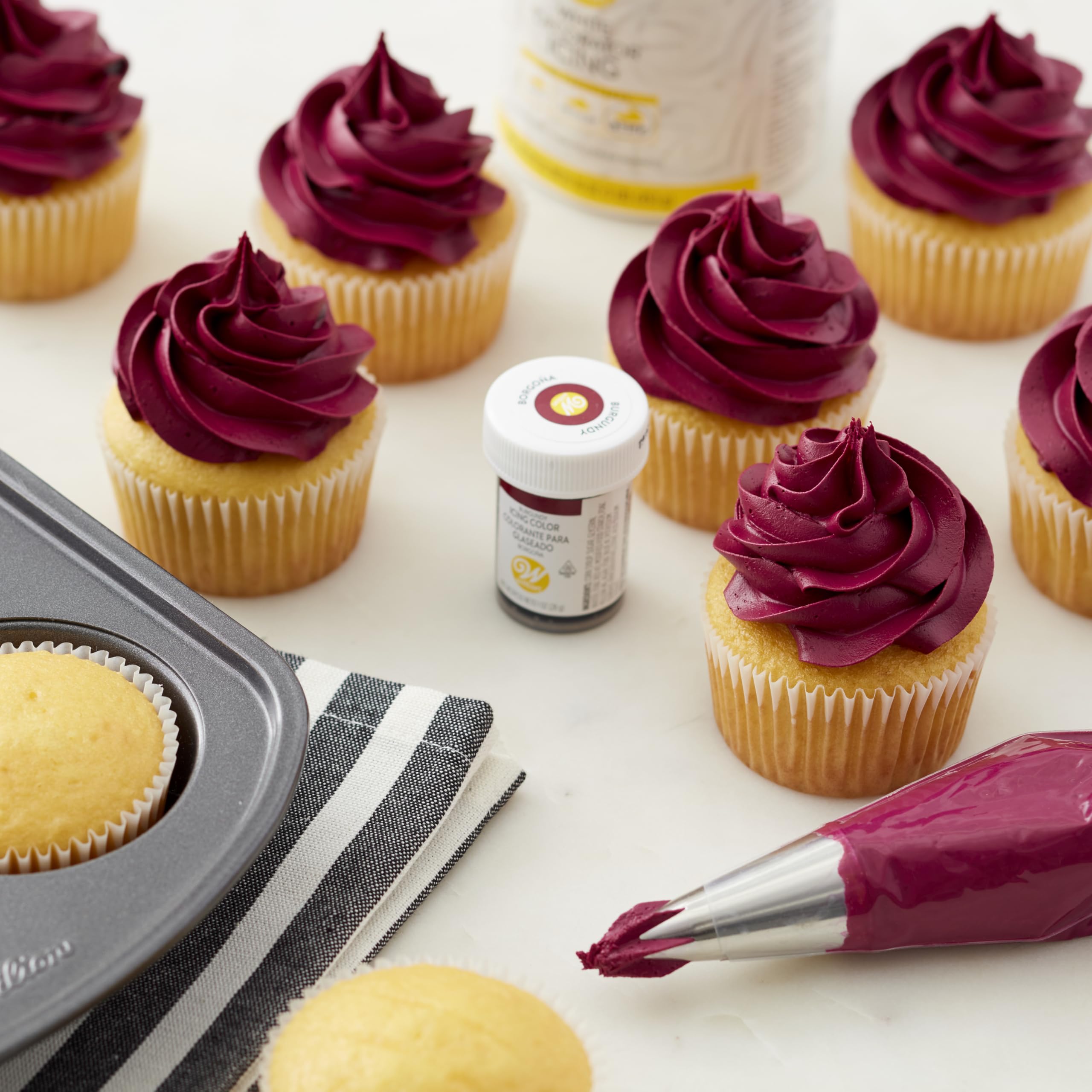 Color-mixing swatch using Wilton burgundy gel color for custom shade