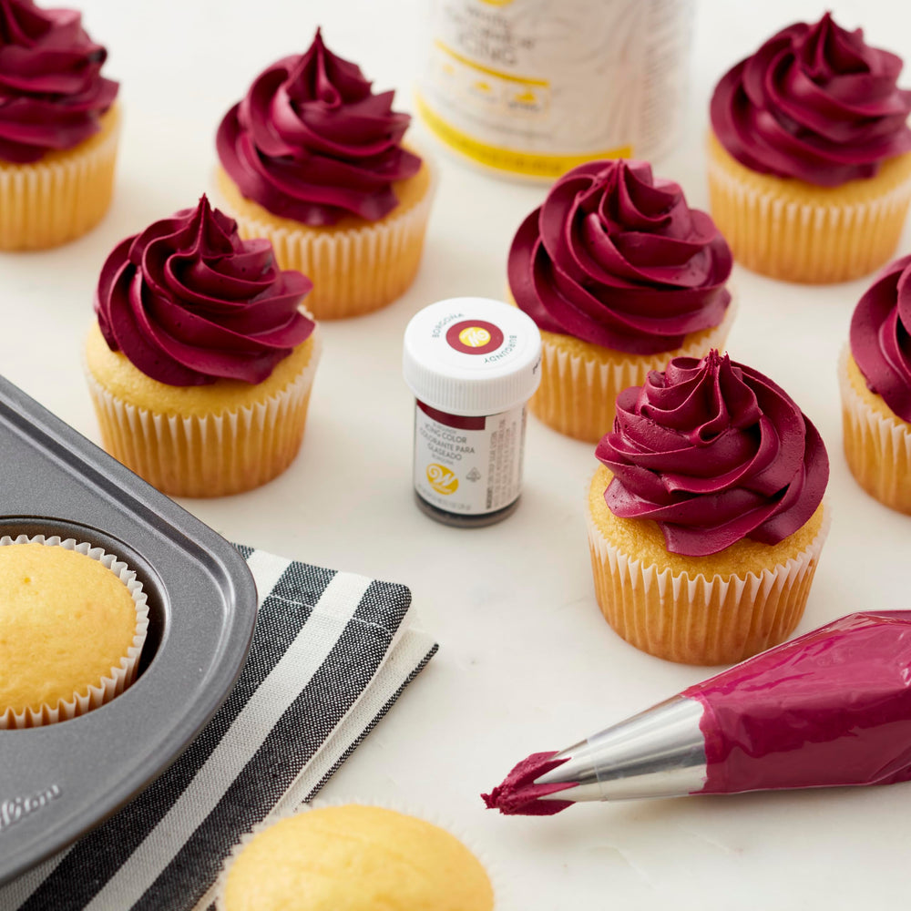 Color-mixing swatch using Wilton burgundy gel color for custom shade