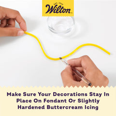 Wilton Dab-N-Hold being used to apply dots for decorations on buttercream.