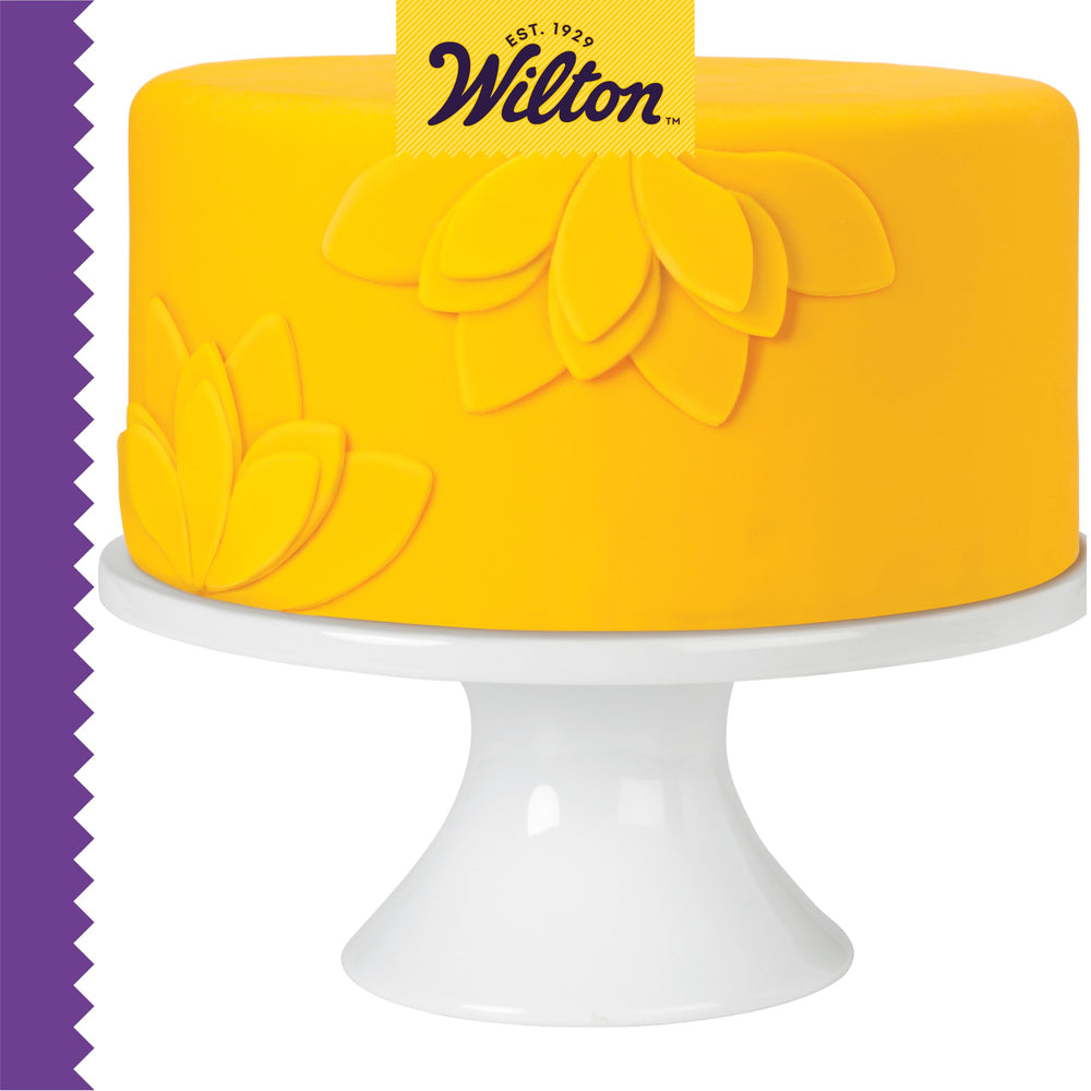 Wilton Dab-N-Hold with sugar sheets for clean attachment.