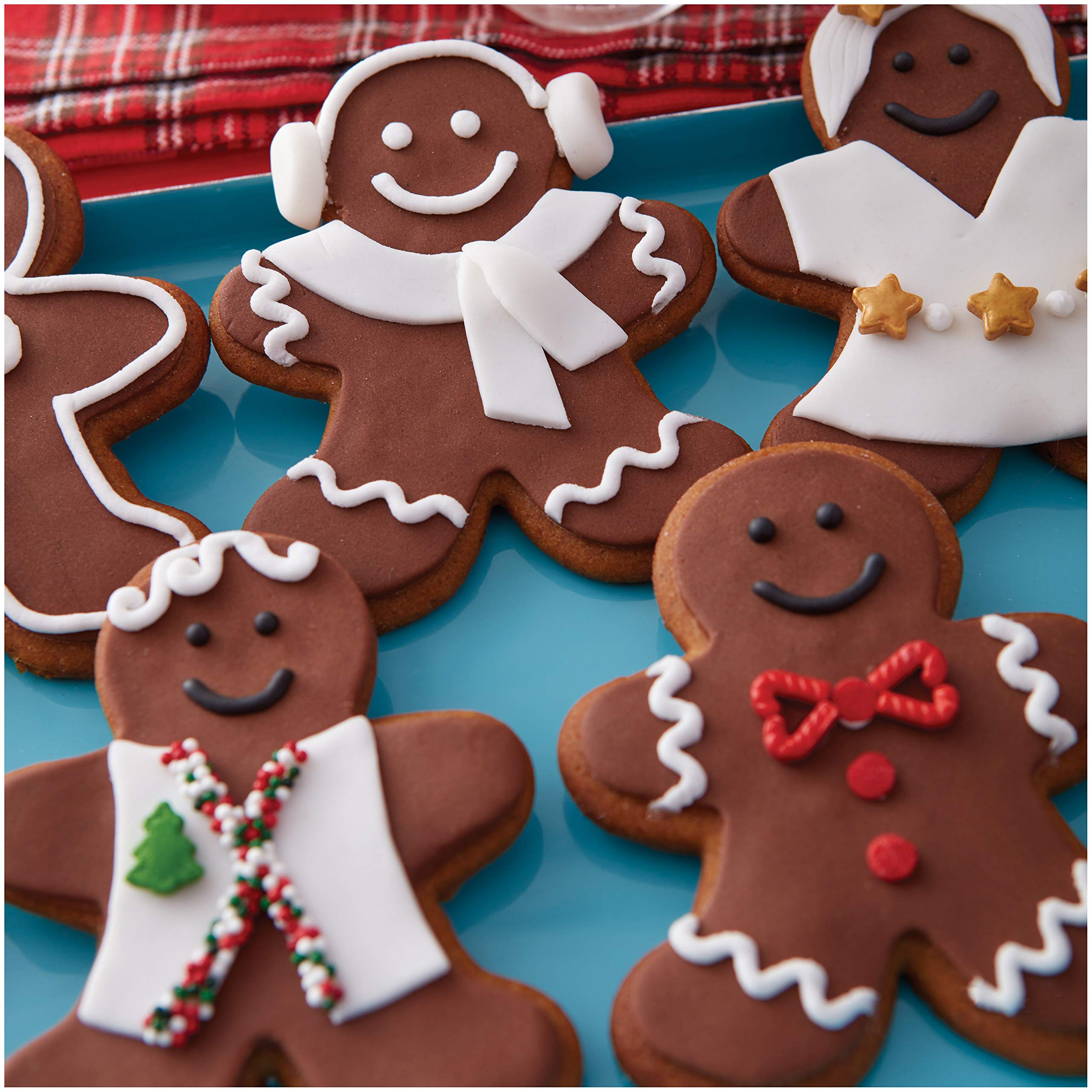 Wilton Decorator Preferred Chocolate Fondant cut-outs create crisp shapes for decorations.