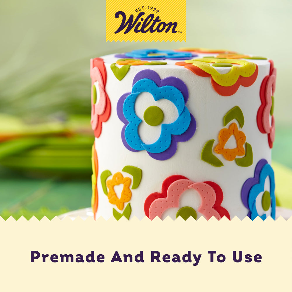 Wilton royal blue fondant shaped into flowers and leaves for cake accents