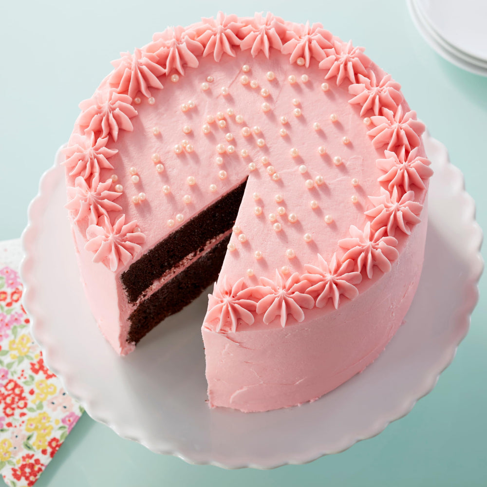 Wilton Pink Sugar Pearls embellish molded candies with glossy pearls.