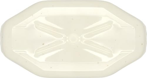 Creamy ranch texture beside a salad plate.