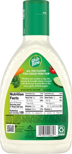 Pouring Wish-Bone Ranch dressing onto a fresh salad.