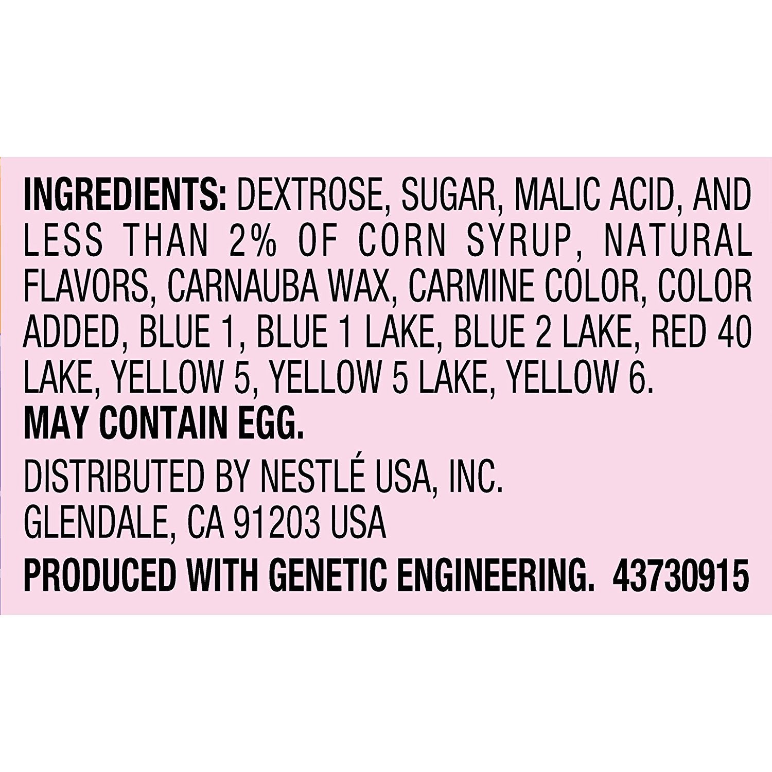 Wonka Rainbow Nerds sprinkled on cupcake adding color and crunchy topping