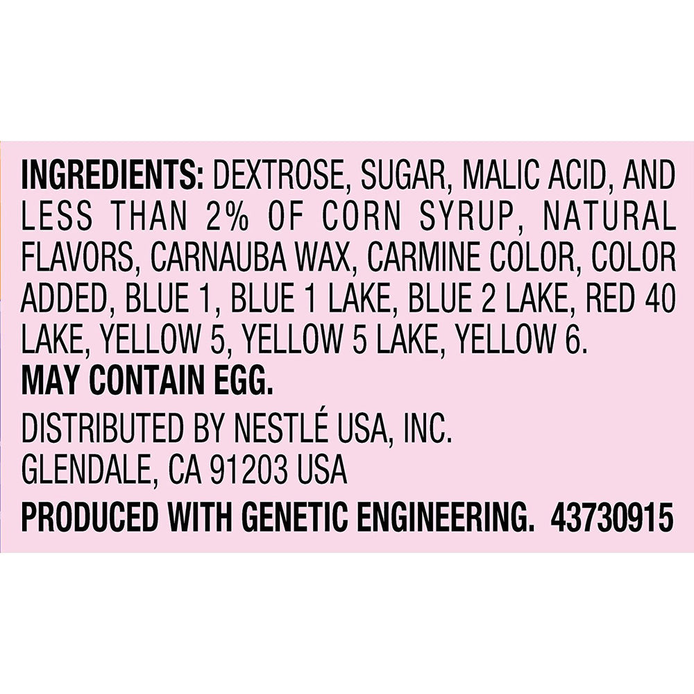 Wonka Rainbow Nerds sprinkled on cupcake adding color and crunchy topping