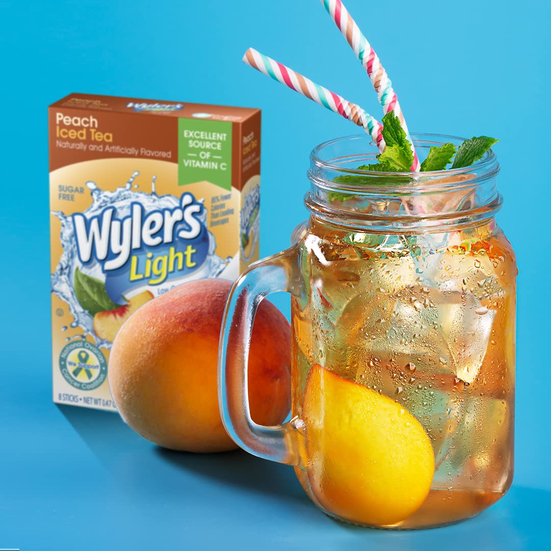 Wyler's Light Peach Iced Tea mix dissolving fast in cold water.