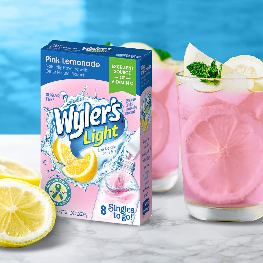 Close-up of Wyler's Light Pink Lemonade packet dissolving in water.