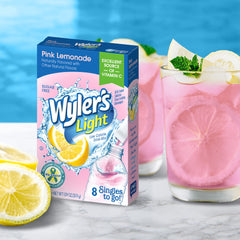 Close-up of Wyler's Light Pink Lemonade packet dissolving in water.