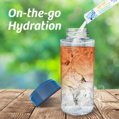 Water bottle with Wyler's powder being added for quick flavor during activity.