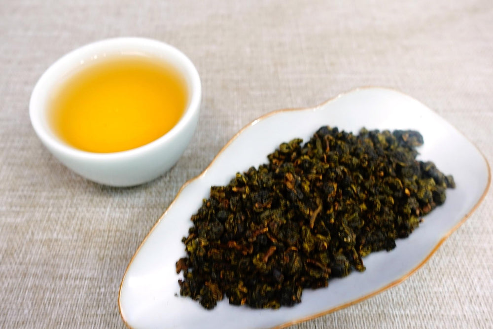 XINQING forest tea garden scene suggesting mountain-sourced quality and purity.