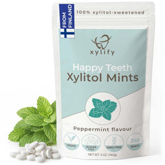 Xylify Happy Teeth mints pack close-up showing peppermint flavor and compact design for fresh breath