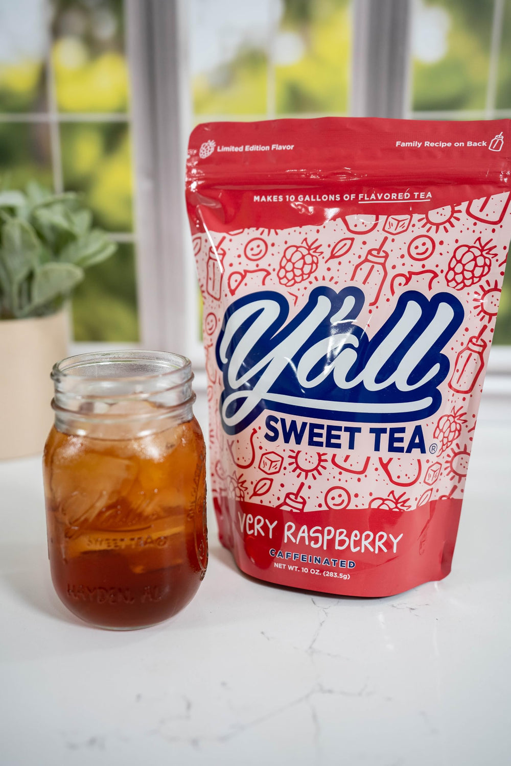 Y’all Sweet Tea Raspberry glass serving showcasing refreshing color for sunny afternoons.