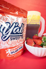 Glass of iced tea made with Y’all Sweet Tea Strawberry Splash Bash
