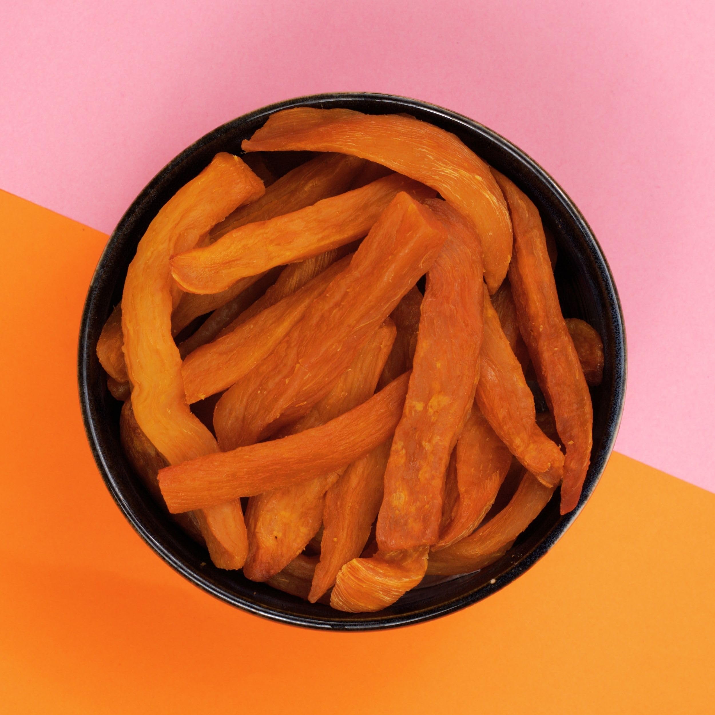 Close-up of Yammy Dried Sweet Potato Sticks caramelized exterior and vibrant color