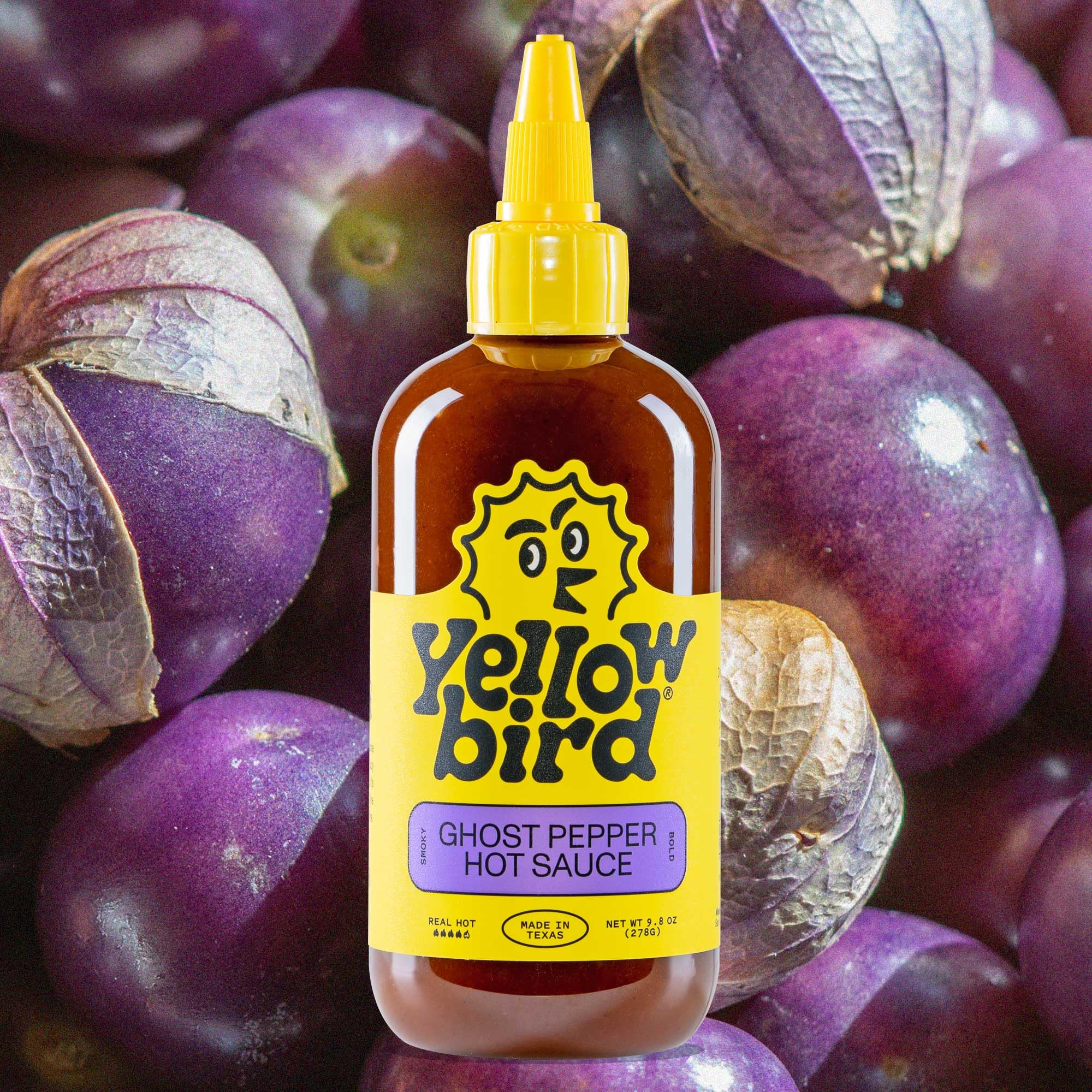 Yellowbird Ghost Pepper sauce with smoky aroma over grilled vegetables