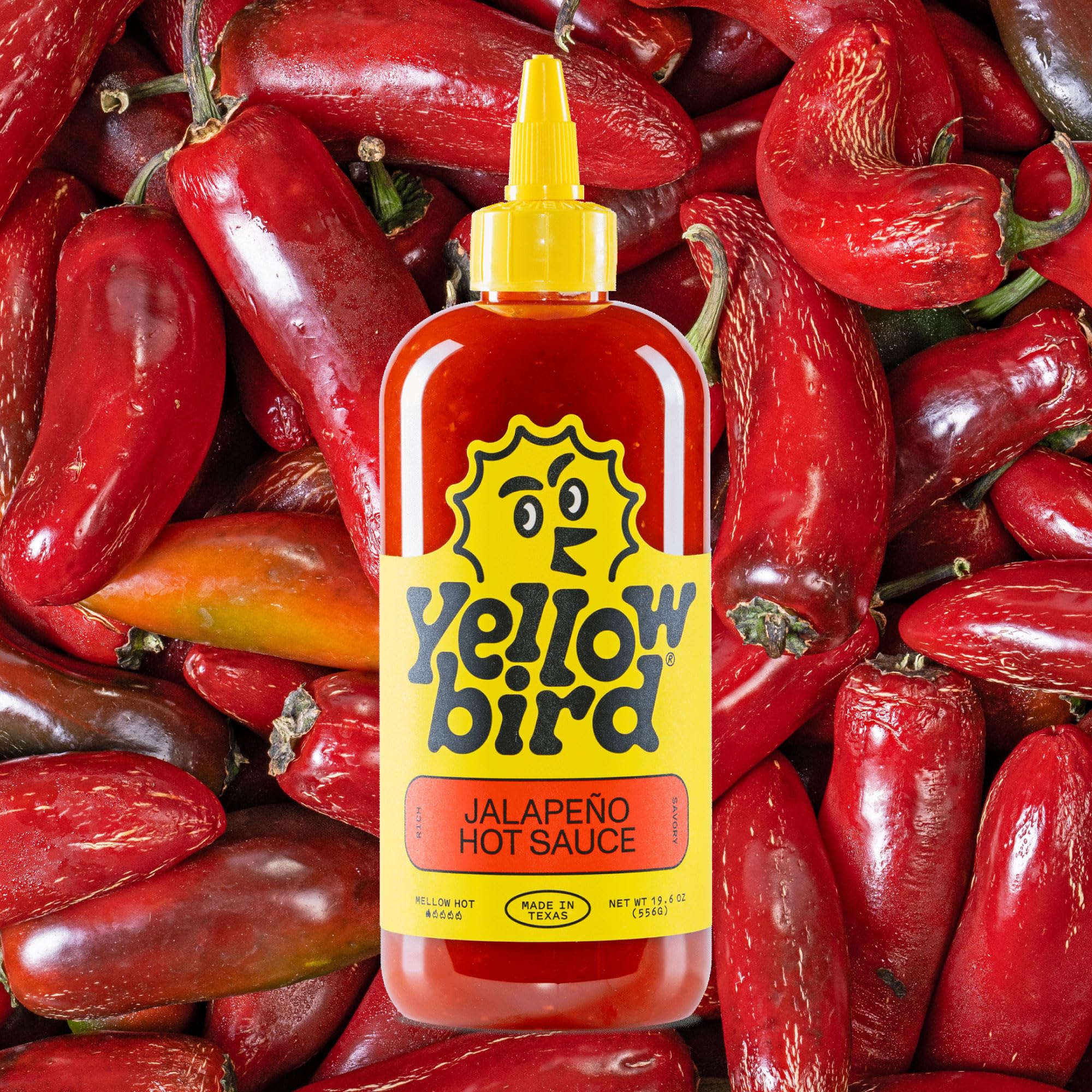 Texas-made stamp on Yellowbird bottle signals local craft and bold flavor.