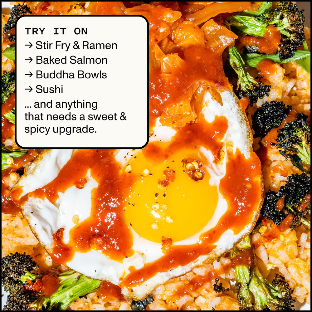 Yellowbird Sriracha smooth pour close-up highlights controlled heat and glaze.