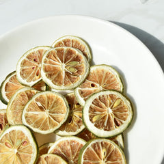 YiLing dried lime slices in a cocktail, infusing bright citrus aroma.