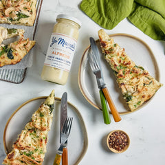 Yo Mama's Foods Alfredo sauce pour over zucchini noodles for keto meals.