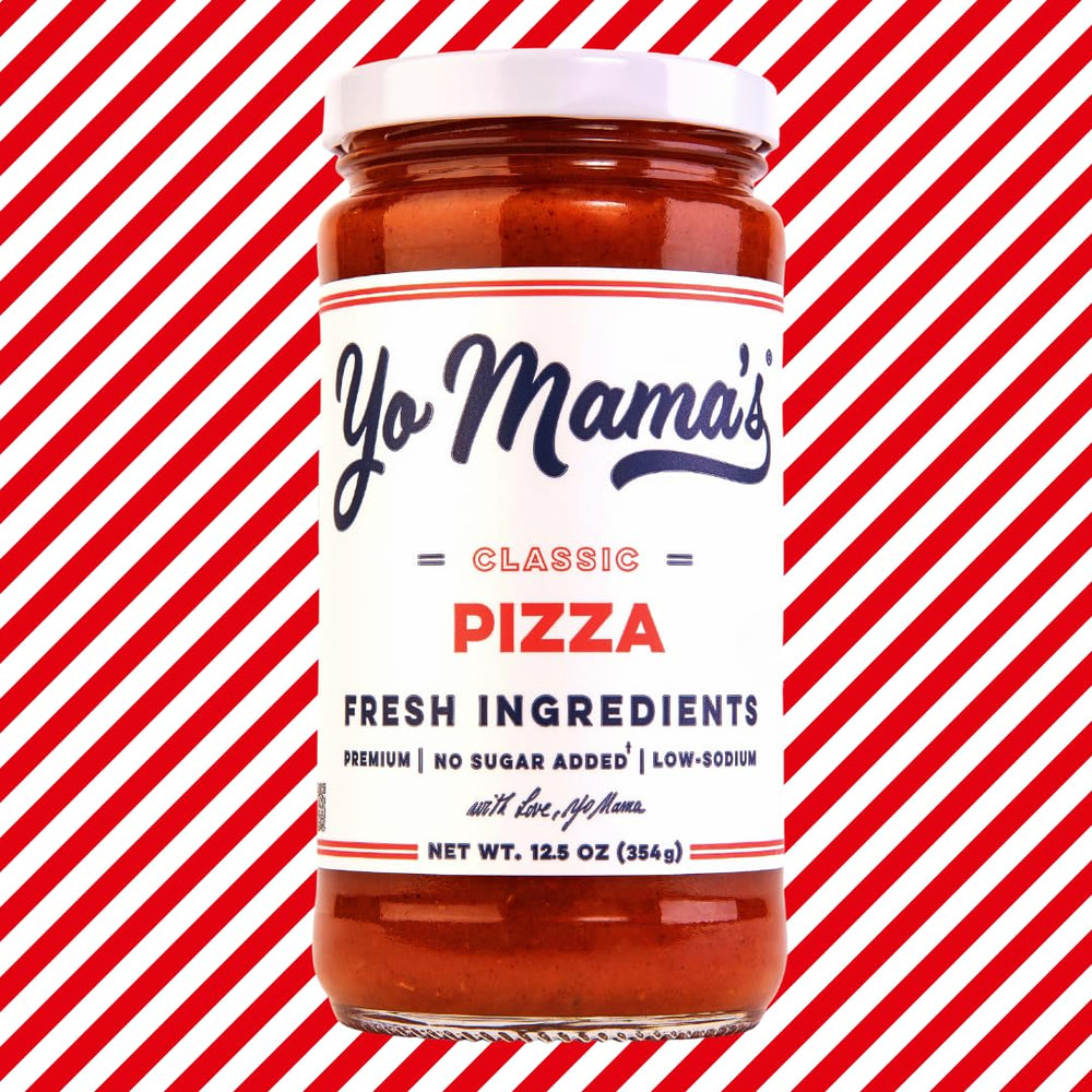 Yo Mama’s Foods Keto Classic Pizza Sauce being poured over a fresh pizza slice for tasty meals.