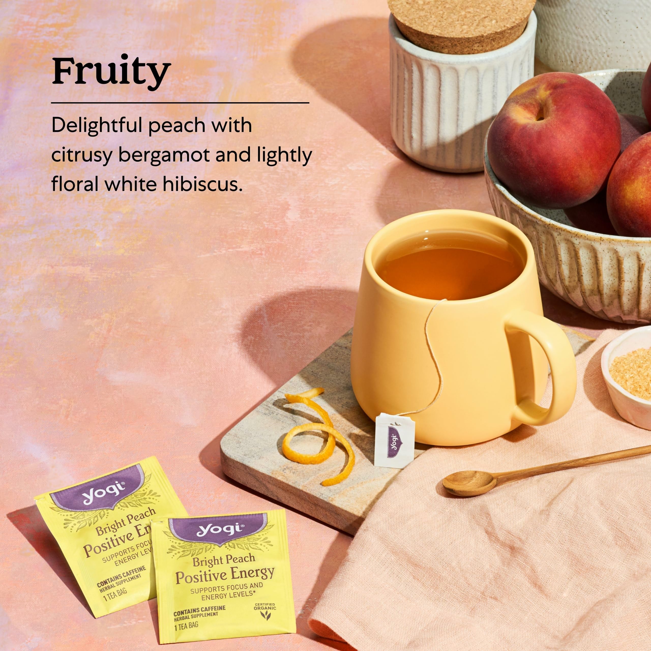 Yogi Bright Peach Tea steeping in kettle highlighting golden infusion and fruit-forward scent.
