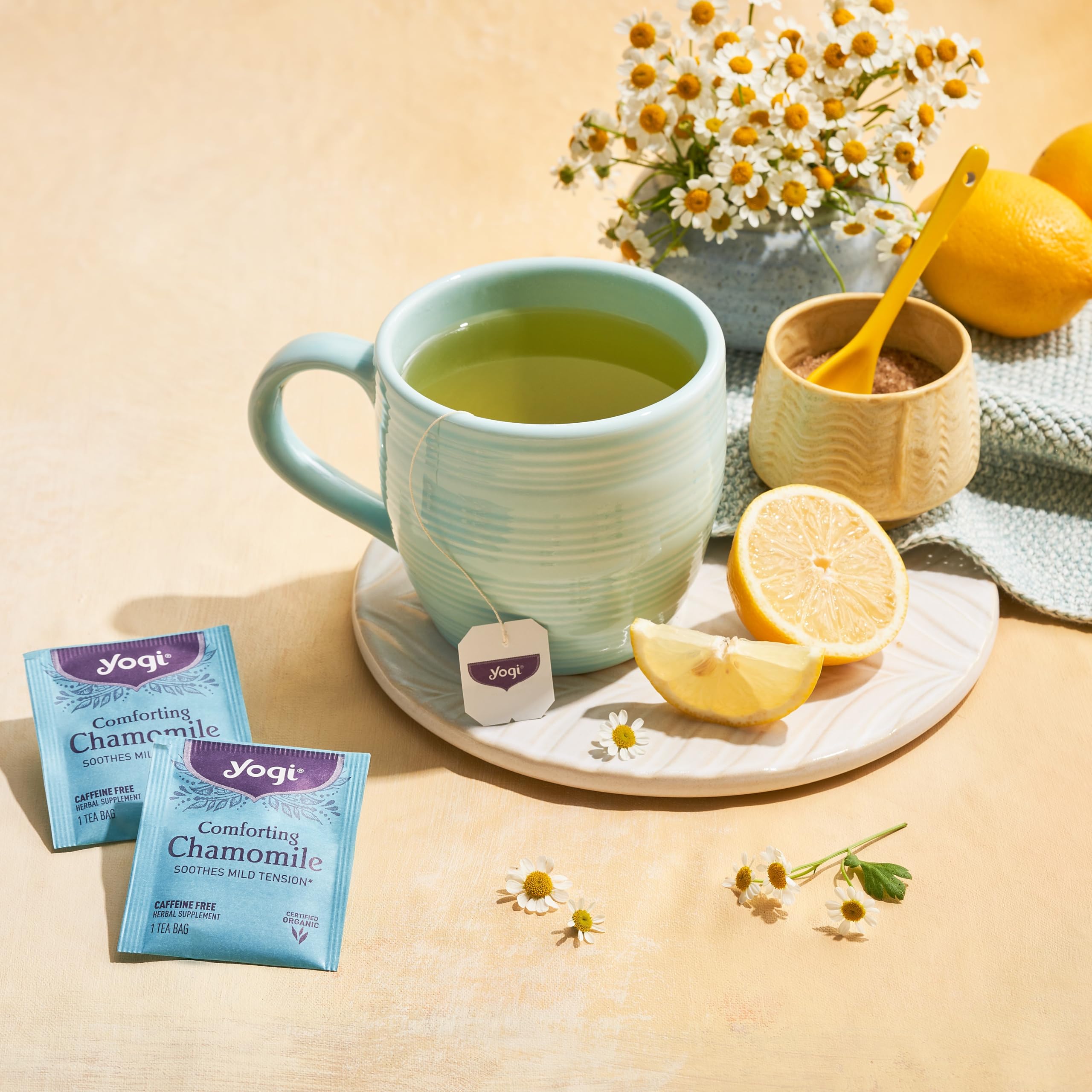 Visible organic chamomile flowers in Yogi tea blend for soothing sips