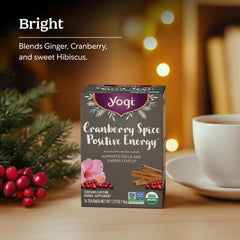 Yogi Cranberry Spiced Positive Energy tea cup with steam highlights festive spice notes.