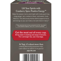 Yogi Cranberry Spiced Positive Energy brew-steeped cup releasing vibrant aroma and caffeine lift.