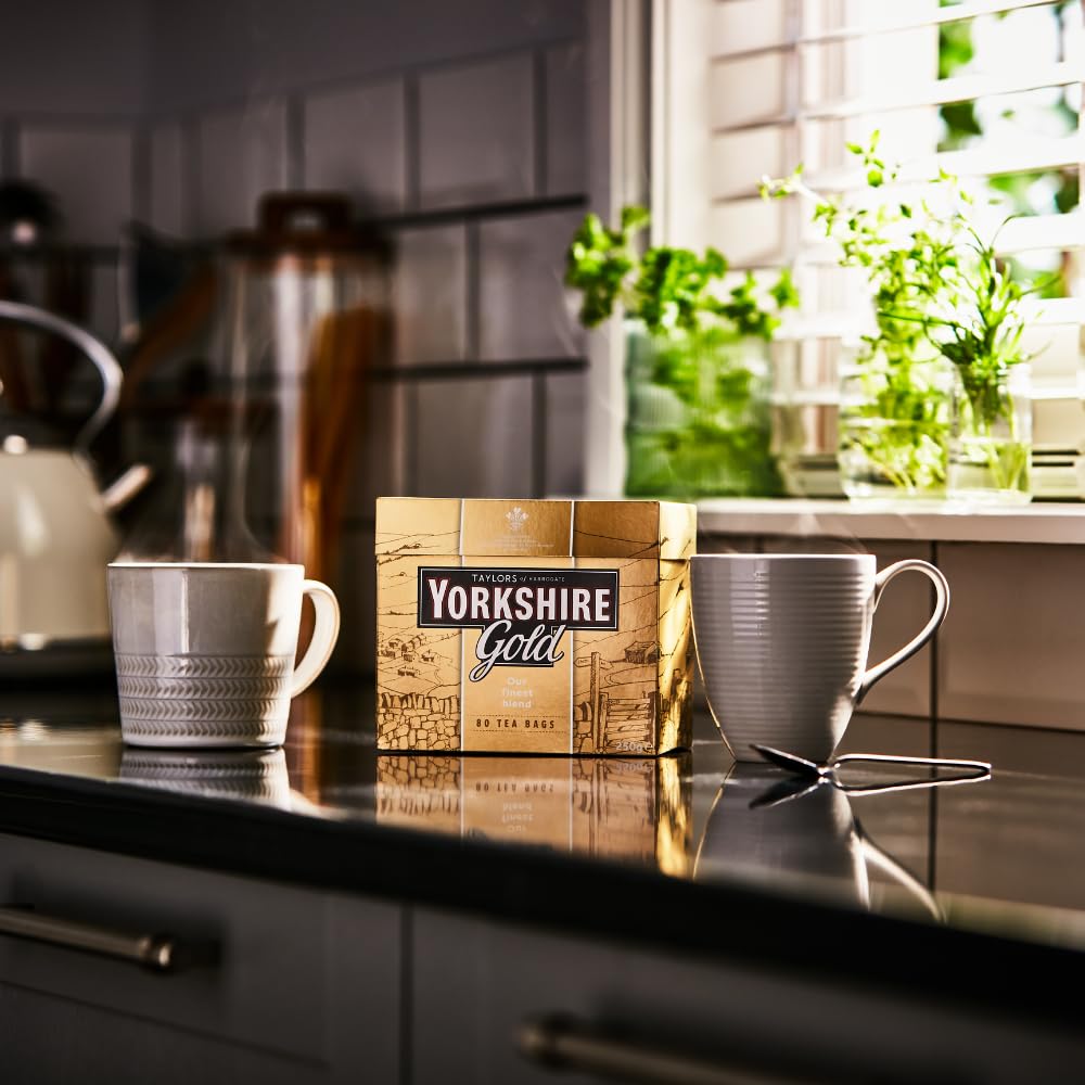 Steam rises from a Yorkshire Tea Gold mug ready to drink.