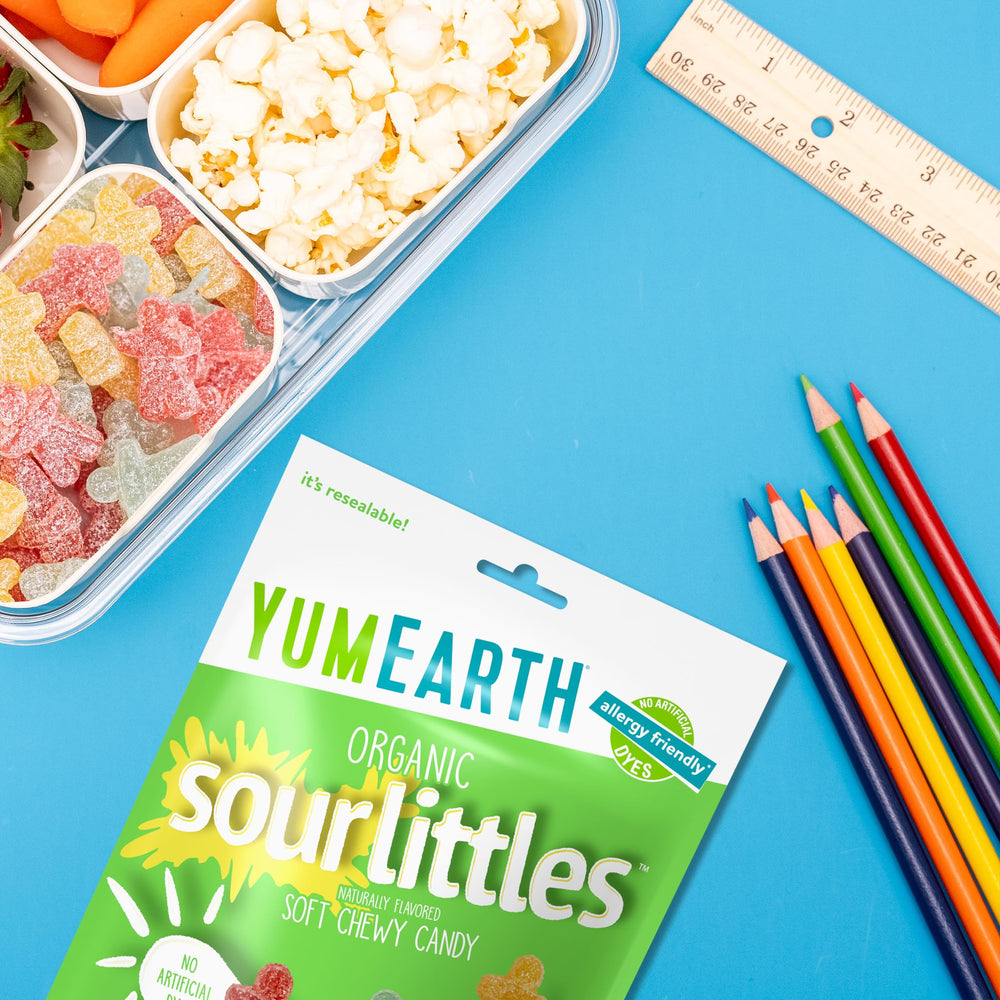 Kids enjoying YumEarth Littl Organic Sour Candy as a quick snack
