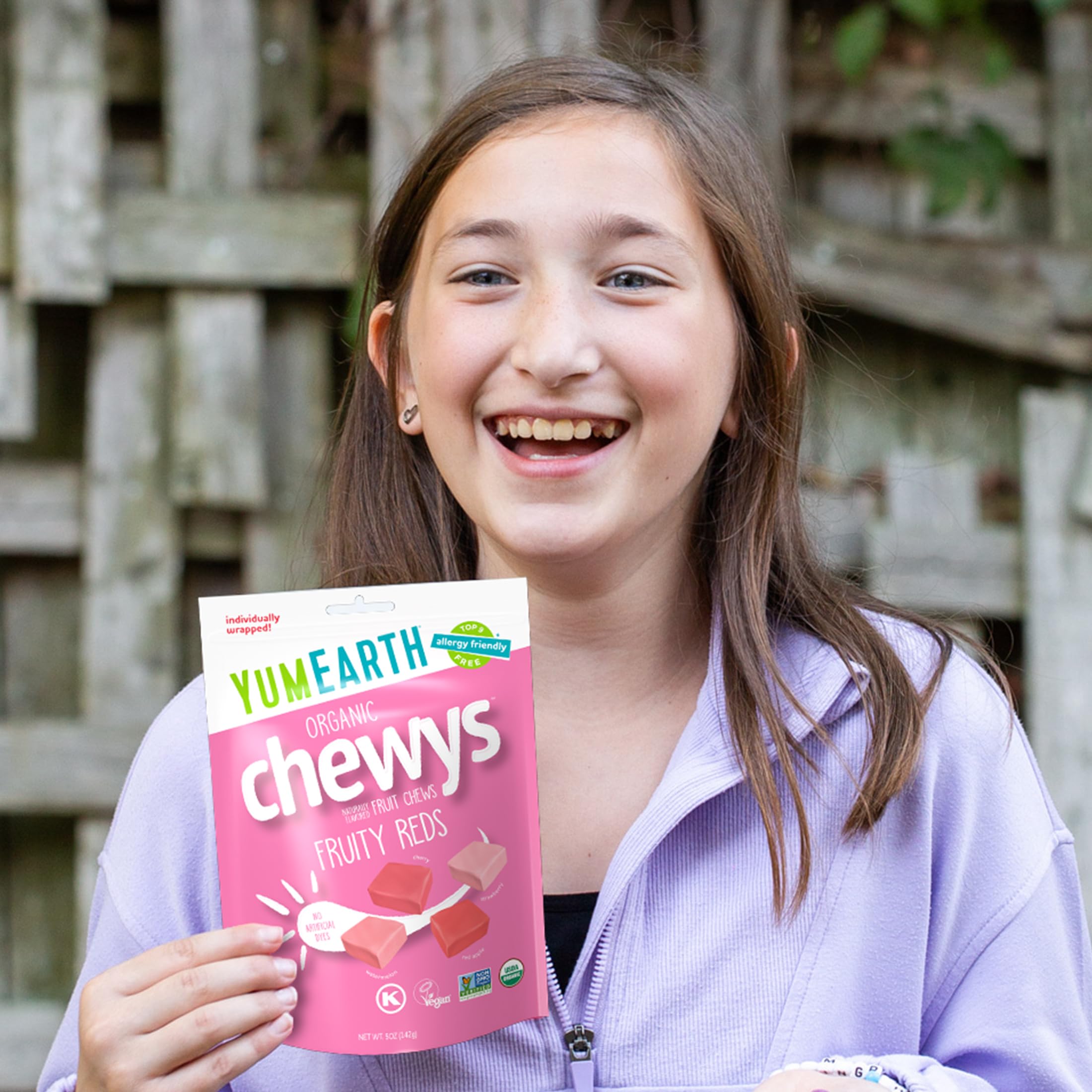 Yogurt topped with YumEarth Chewys Organic Fruity Reds for fruity brightness