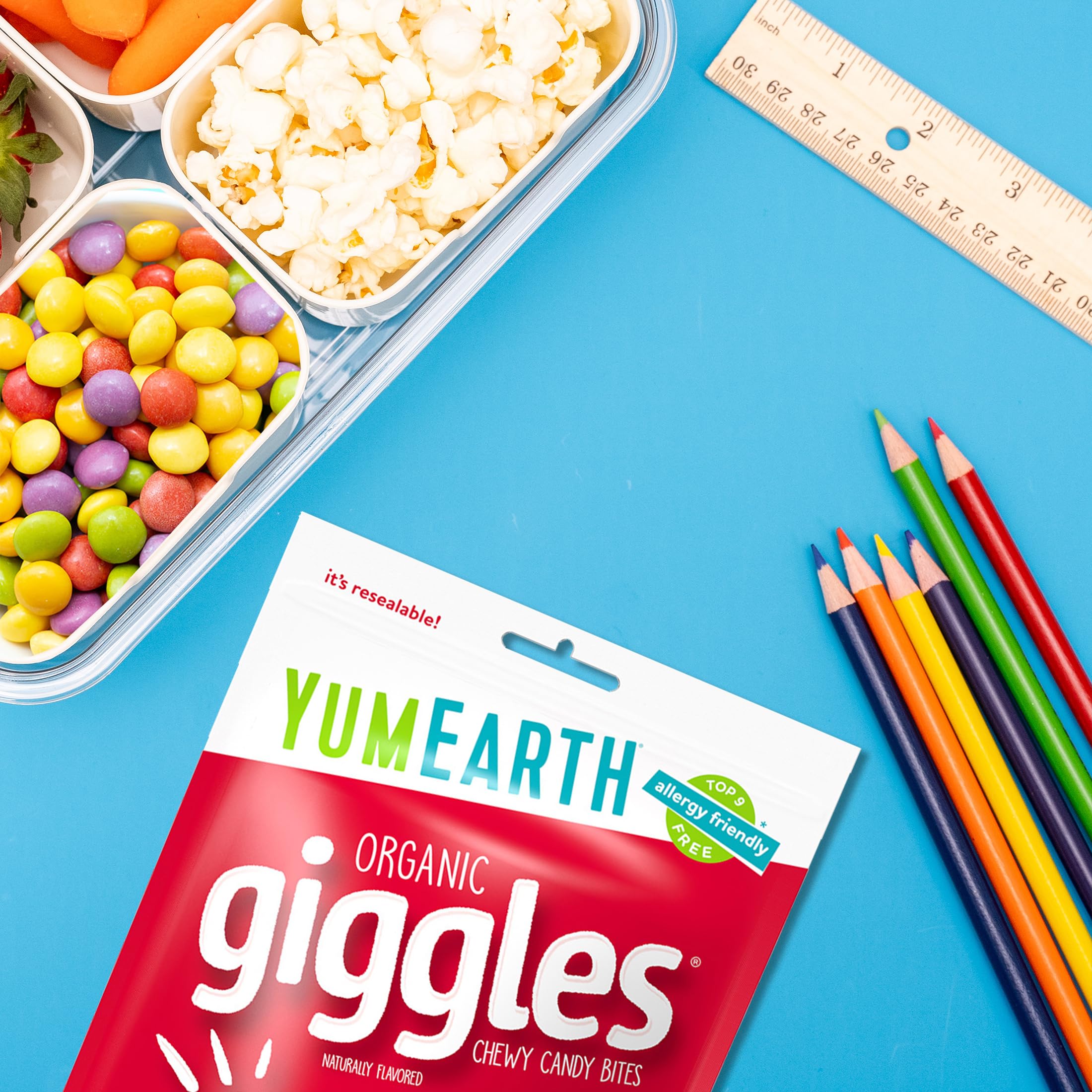 YumEarth Giggles school-snacks scene suggests kid-friendly portable treats.