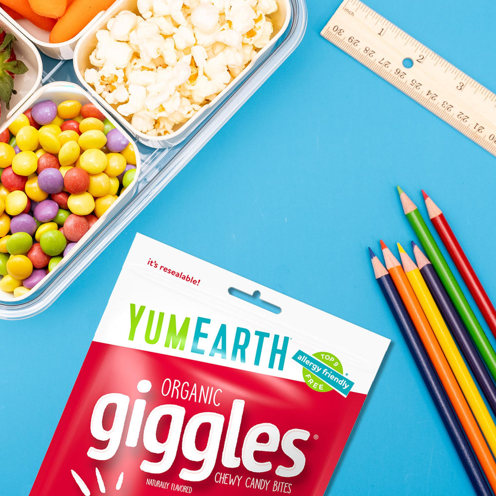 YumEarth Giggles school-snacks scene suggests kid-friendly portable treats.