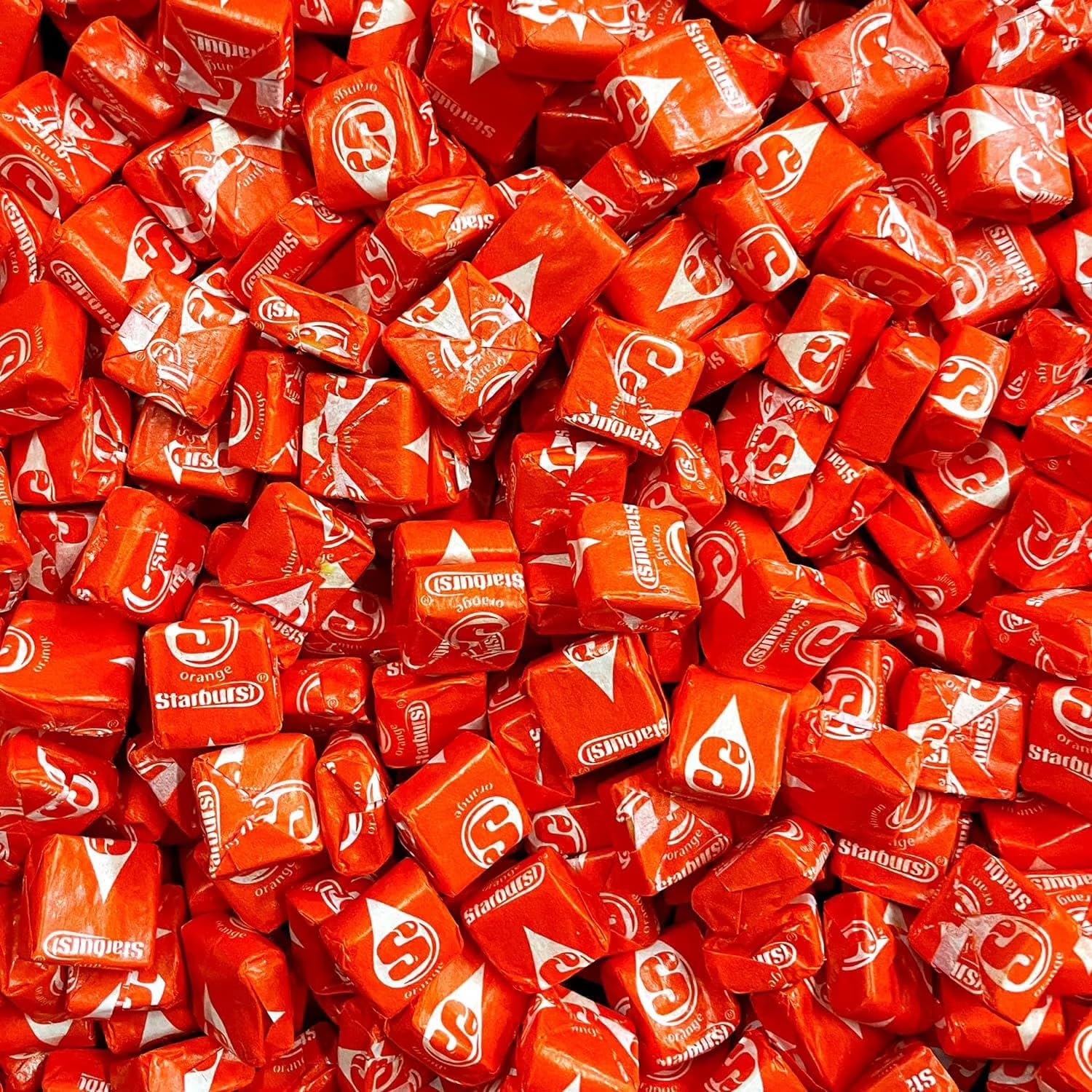 YUMMYLAND Star Bursts Orange candy bag with bright orange chews for parties.