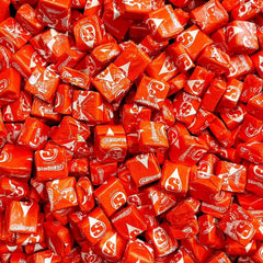 YUMMYLAND Star Bursts Orange candy bag with bright orange chews for parties.
