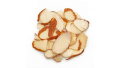 Yupik almonds with skins visible; cream color with brown skin ring.