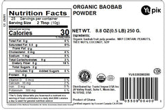 Yupik Organic Baobab Powder scoop beside jar for easy measuring