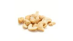 Yupik cashew pieces in a bowl, ready to top salads for extra crunch.