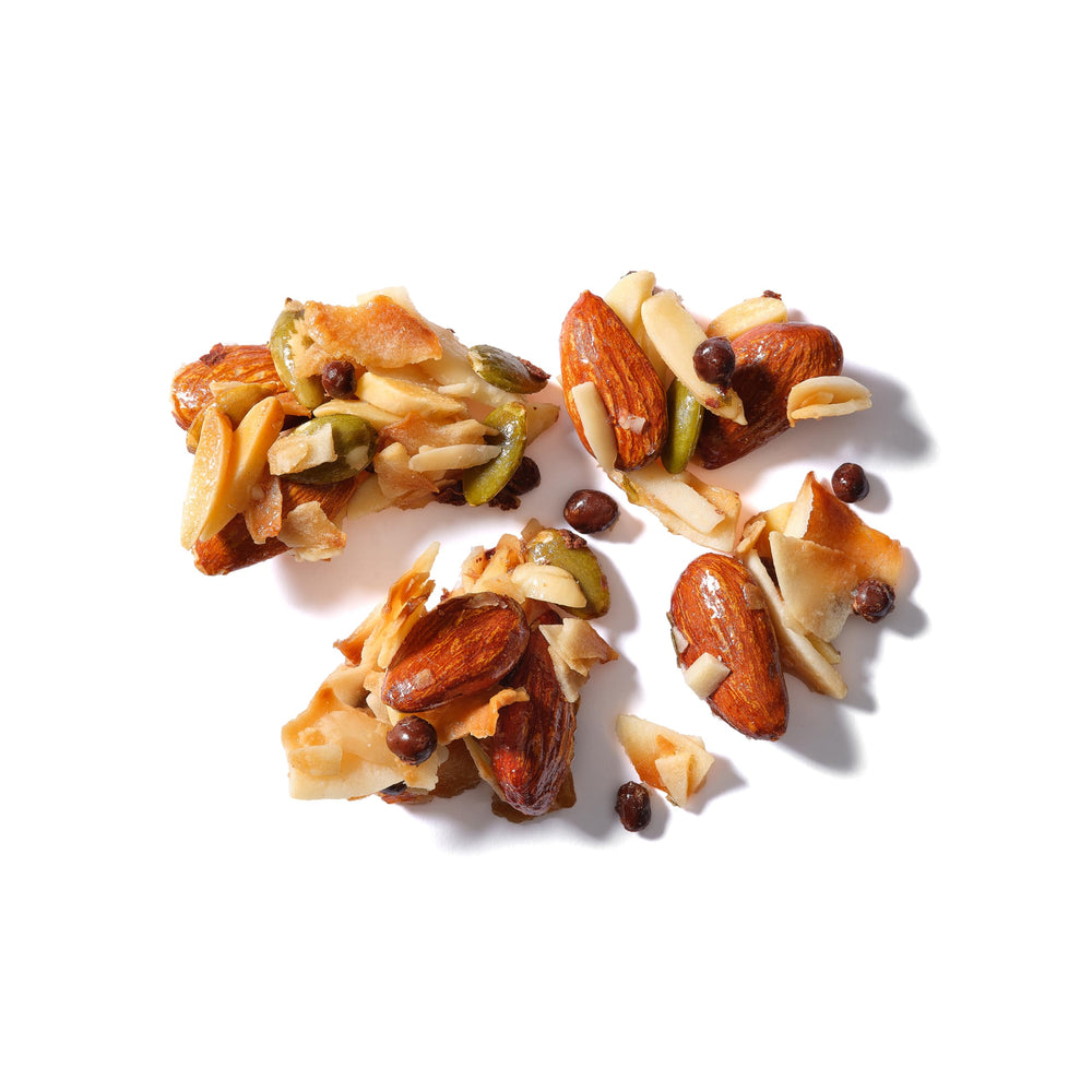 Yupik Coconut Clusters with Almonds pack-shot, nutty clusters perfect with coffee.