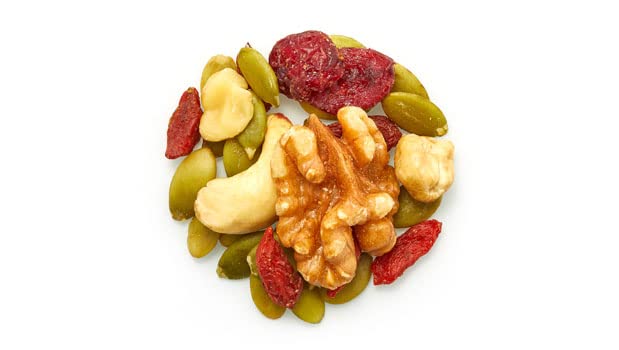 Hand holding Yupik Goji Sport Trail Mix as a convenient snack