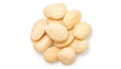 Close-up of skinless, blanched Yupik Marcona almonds showing premium quality