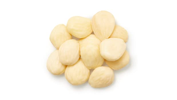 Yupik Marcona almonds skinless close-up reveals buttery texture and pale color.